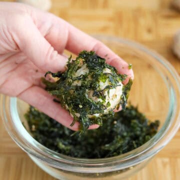 Korean rice balls coated evenly in seasoned seaweed flakes