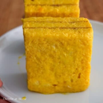 Crustless peanut butter sandwich evenly coated in beaten egg.
