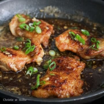 Chicken thighs coated in thick honey garlic sauce