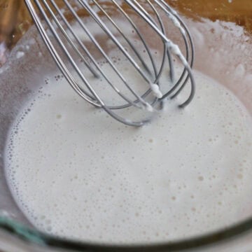 In a medium bowl, whisk together tempura batter ingredients until smooth and runny.