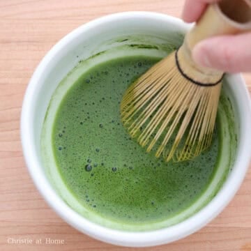 Sift the matcha powder into a small bowl. Add hot water (about 176ºF / 86ºC measured with a digital instant-read thermometer), then whisk in a zigzag motion until frothy, about 30 seconds.