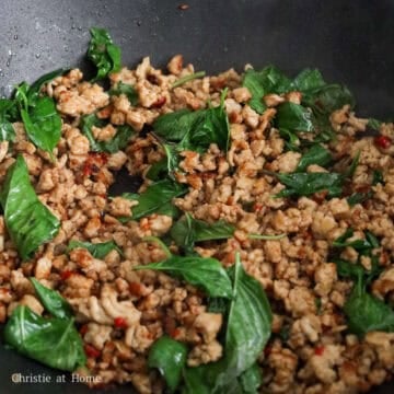 Holy basil stir-fried with the seasoned ground meat until slightly softened.