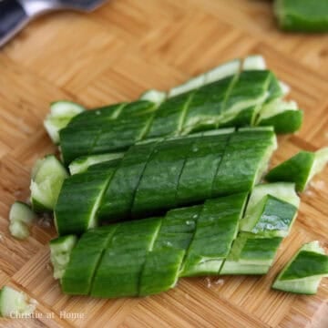 Smashed cucumbers cut crosswise into ¾-inch-wide pieces.