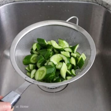 Rinsed cucumber pieces drained thoroughly to remove excess water.