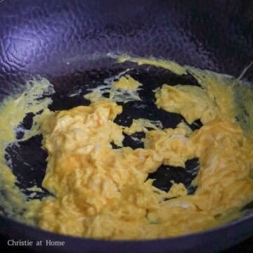 Eggs stir-frying in a wok for egg fried rice