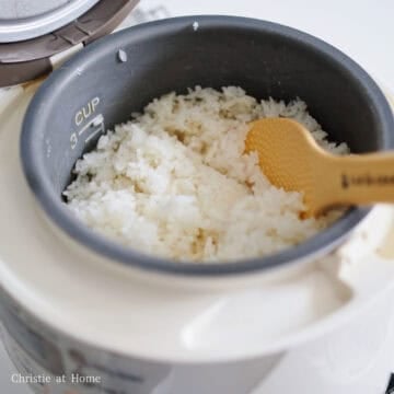 First season hot cooked rice with sesame oil and salt. Mix well with a rice paddle. Set aside and keep covered so it stays moist and warm.