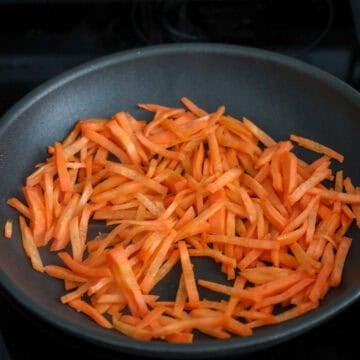 Heat 1 teaspoon vegetable oil on low-medium heat and sauté carrots with ⅛ teaspoon salt until vibrant and softened, about 1-2 minutes. Remove and set aside.