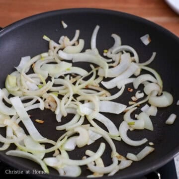 Sliced onions lightly browned and spread into a single layer
