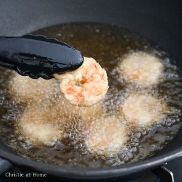Heat vegetable oil in a large pan to 350 degrees F, around medium heat. Fry 6 pieces of shrimp at a time until golden and crispy or 2 minutes in total, flipping over halfway. Do not overcrowd the pan.