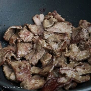 Beef strips seared until lightly browned on the edges.