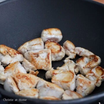 Heat vegetable oil in a large pan on medium heat. Brown seasoned chicken until golden brown on both sides, about 5-6 minutes in total. Do not cook it through yet. Remove and set aside. 