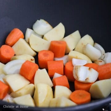 Add onions, carrots and potatoes into the pan and cook for 2 minutes. 